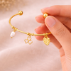 Gold Charm Bangle with Pearl and Leaf Accents