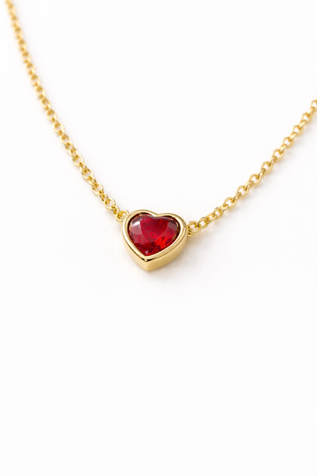 Gold Heart Pendant with Red Gemstone