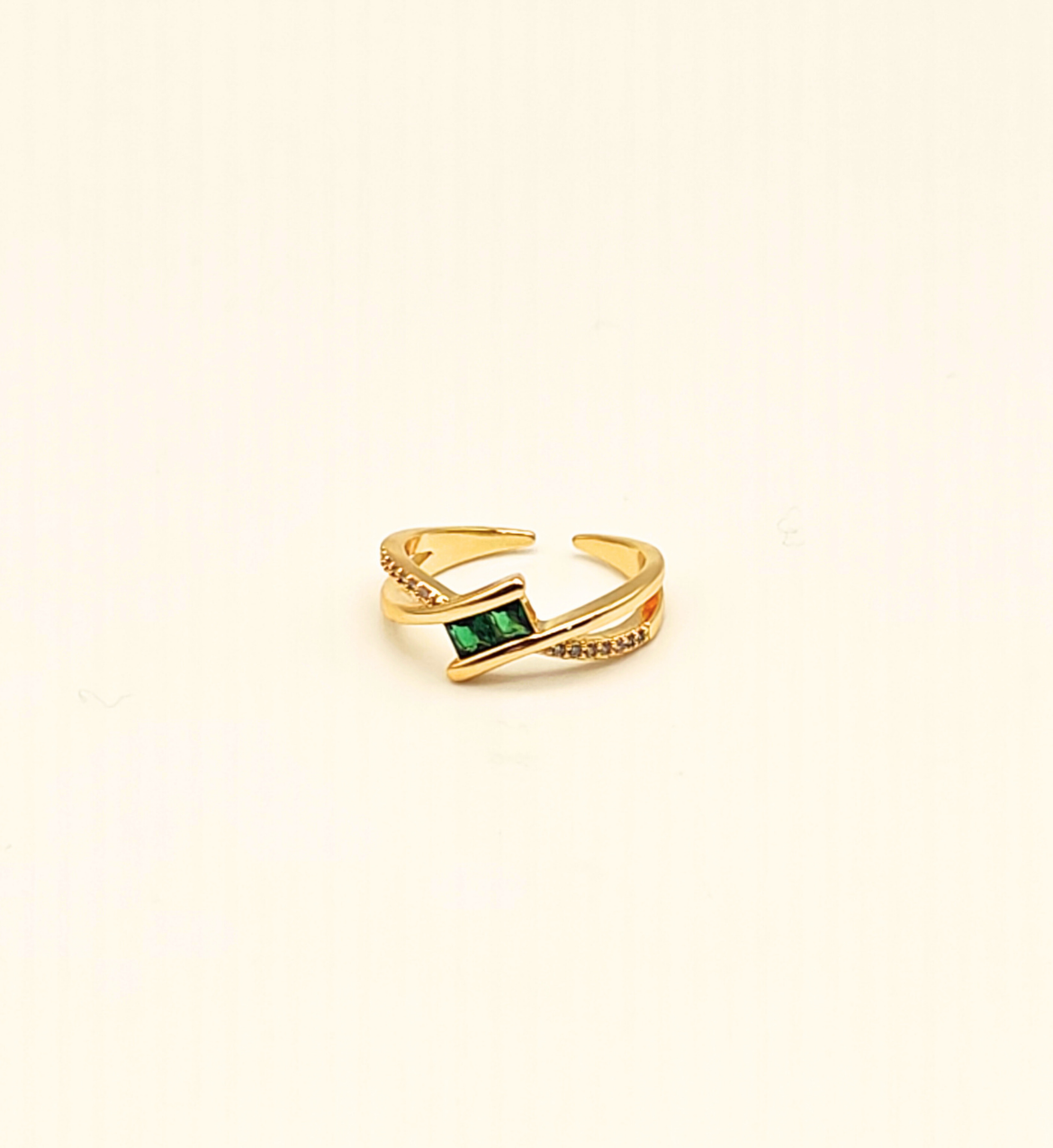 Gold Crossed Band Ring with Emerald and Clear Stones
