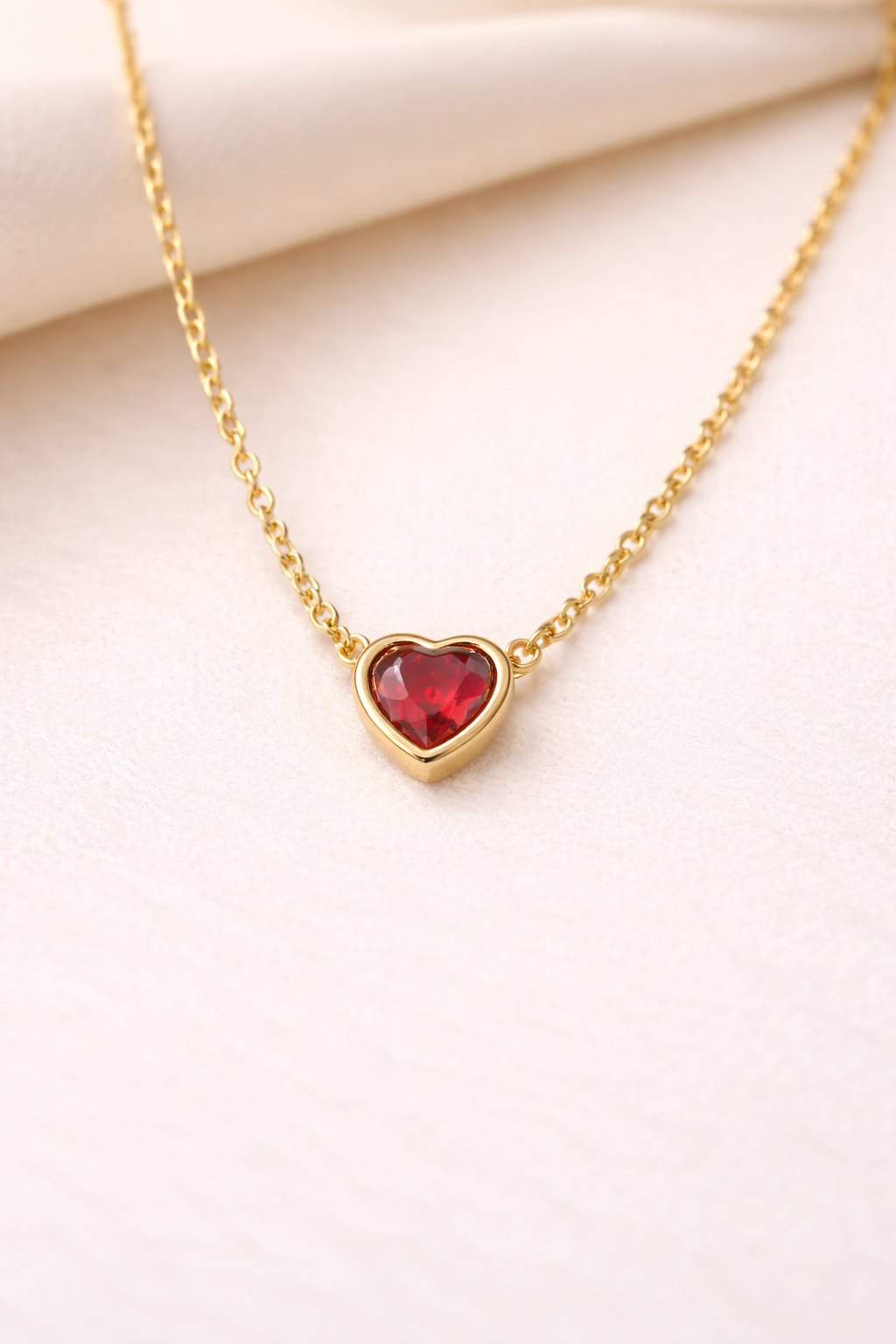 Gold Heart Pendant with Red Gemstone